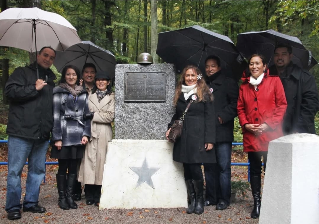 Kristen Nemoto Jay with Susan Harada and five other at Bruyères, Lorraine, France at the American Monument in the Helledraye Forest. (Photo courtesey of Kristen Nemoto Jay)